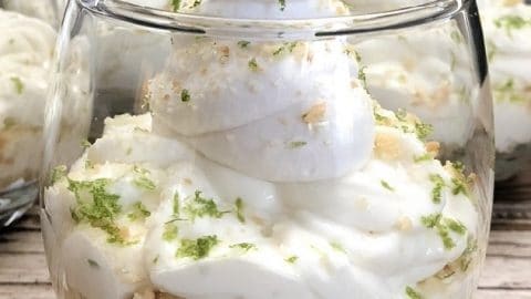 close up of mini key lime cheesecake parfait garnished with lime zest