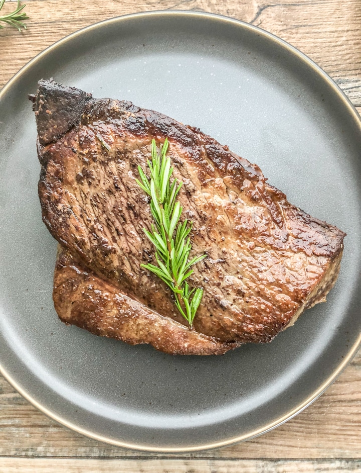 Close up shot of london broil on plate.