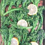 oven roasted broccolette recipe in sheet pan and garnished with lemon