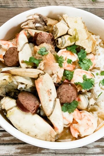 close up of seafood gumbo in a white bowl