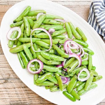 snap peas on white serving platter