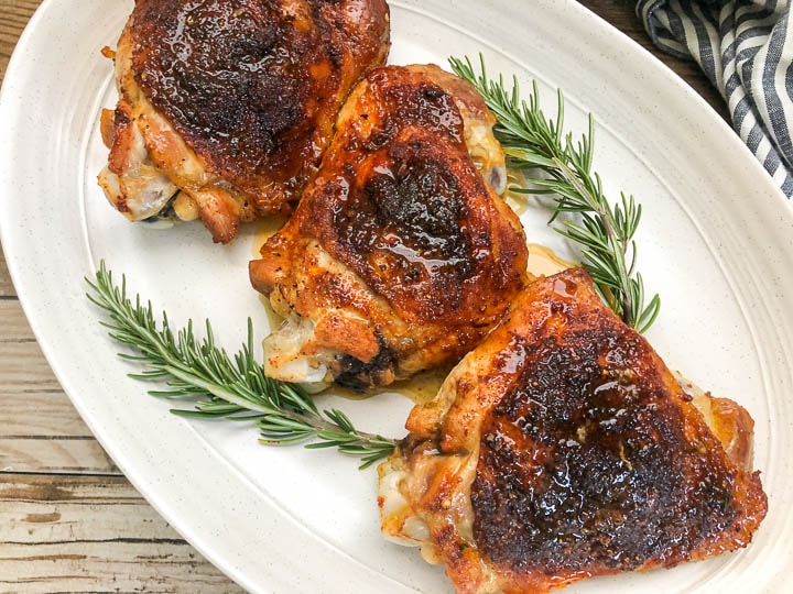 roasted turkey thighs served on white oval platter