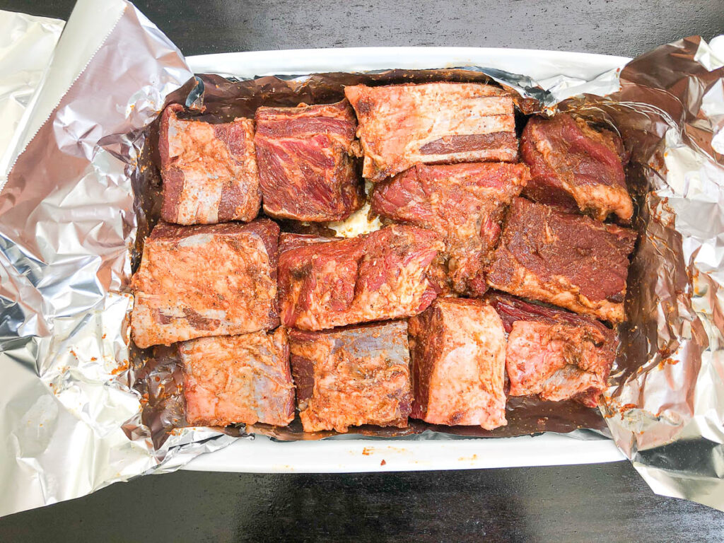 marinade poured onto ribs and massaged all over meat