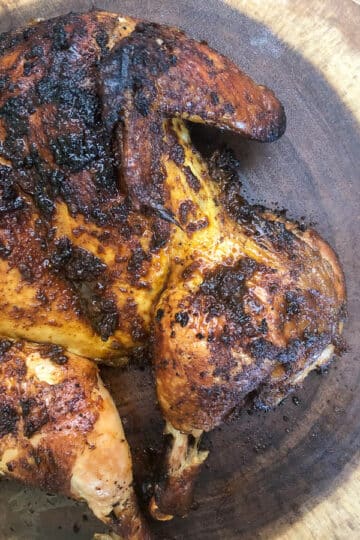 grilled chicken on wooden platter