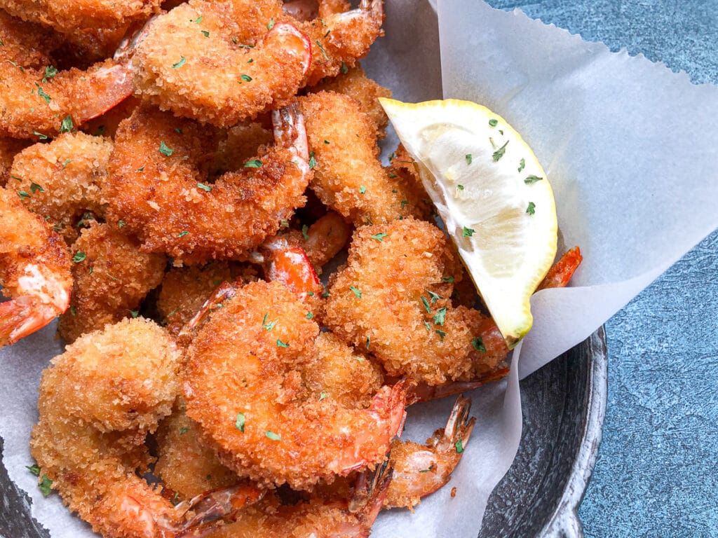 close up shot of fried shrimp in platter for tacos