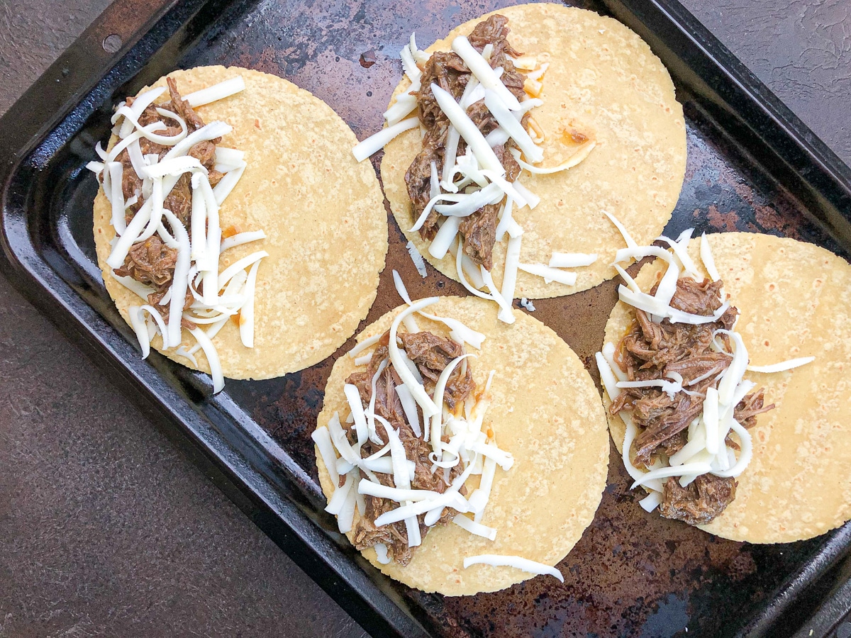 tortillas with shredded beef and cheese.