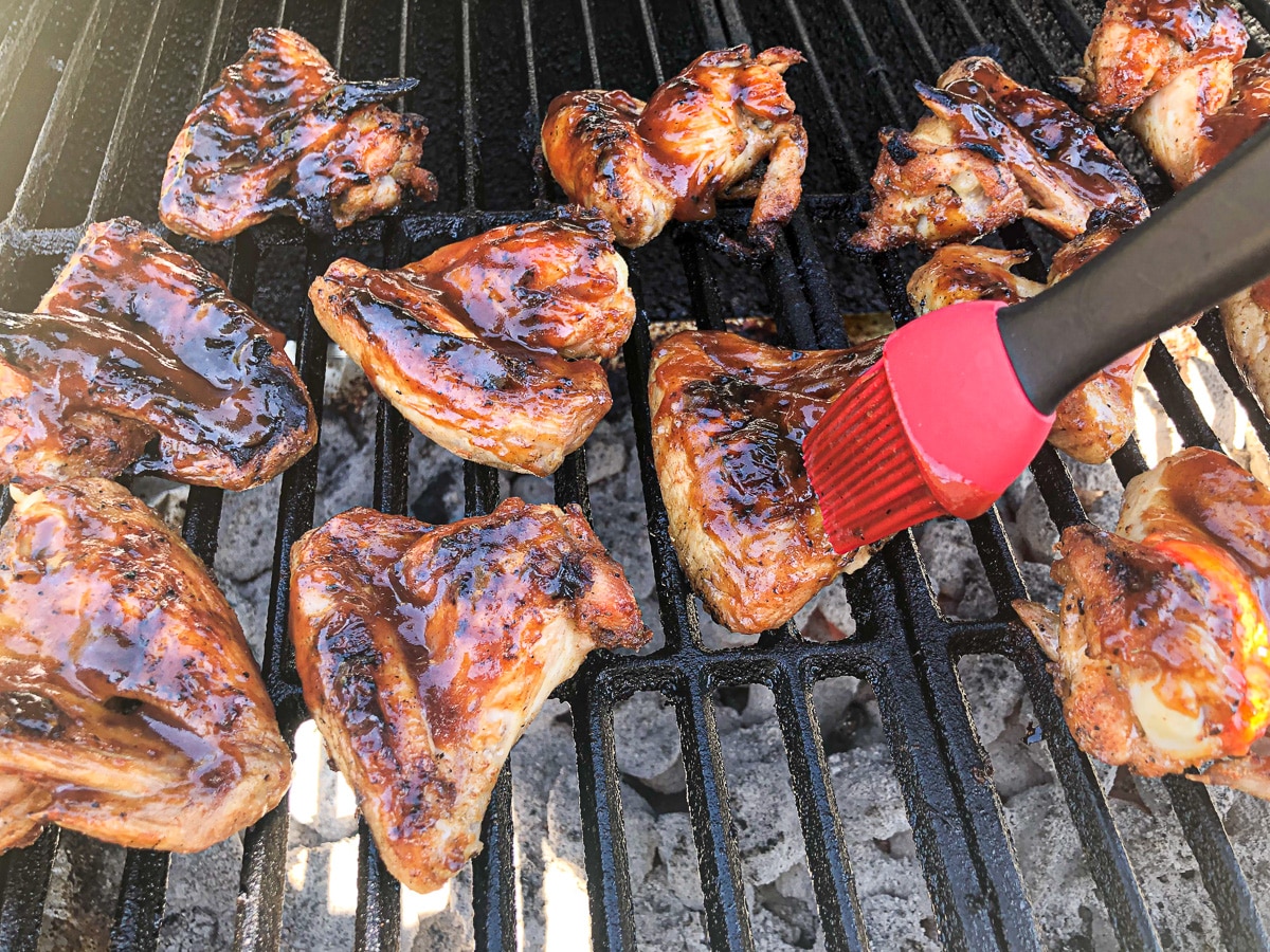 grilled chicken wings brushed with bbq sauce.