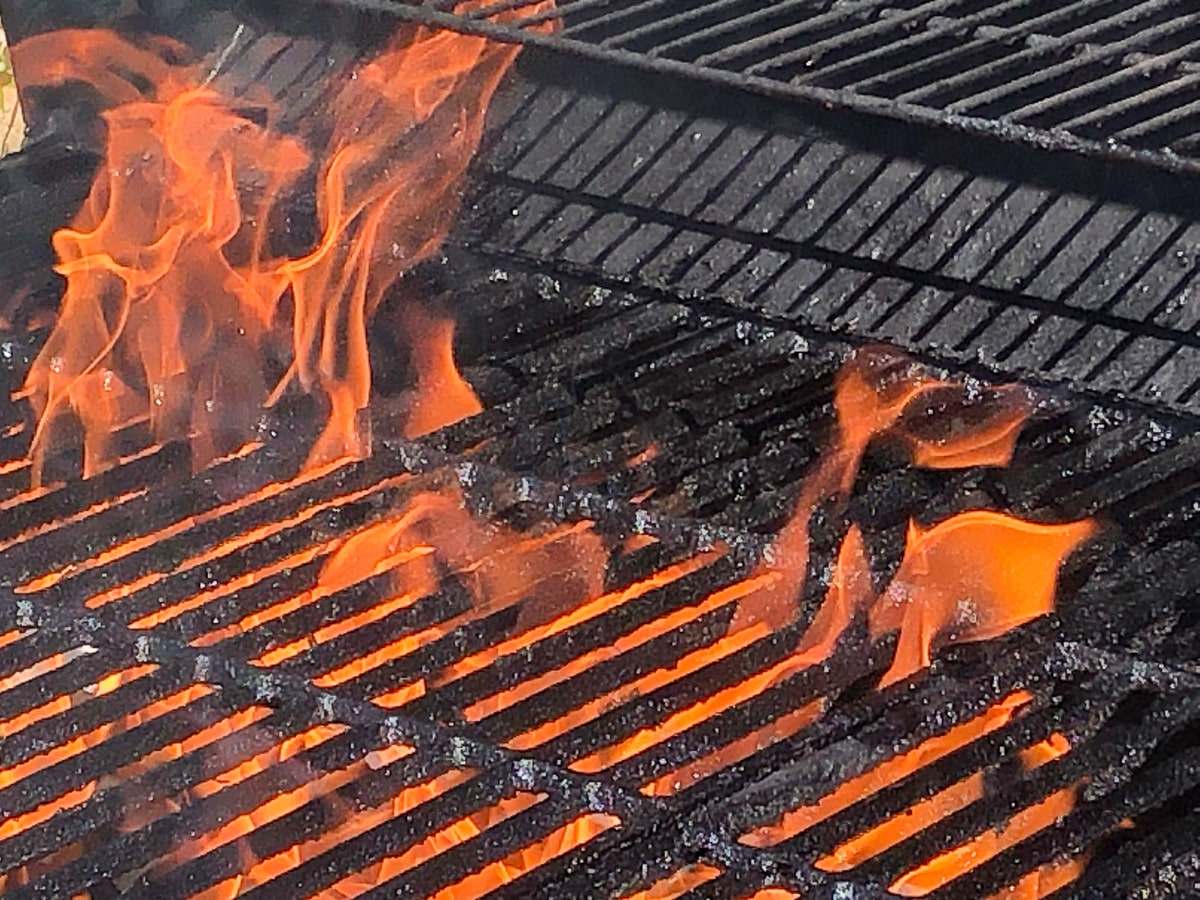 fire shown on charcoal grill.
