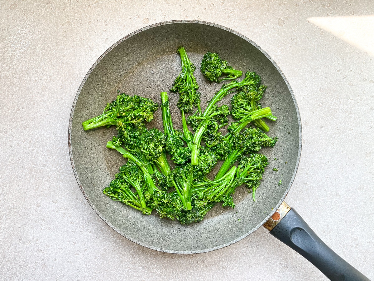sauteed broccolini in saute pan.