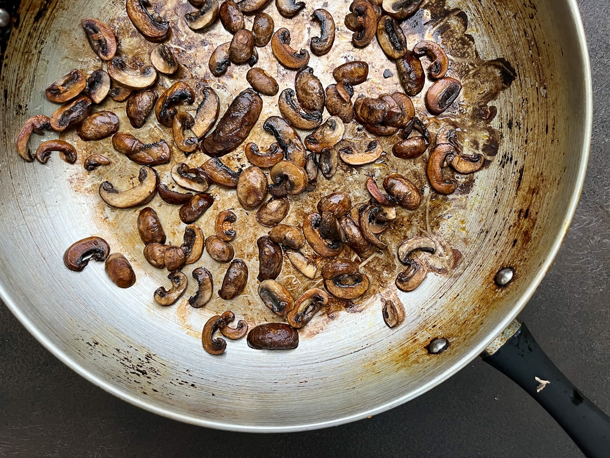 sauteed mushrooms in saute pan.