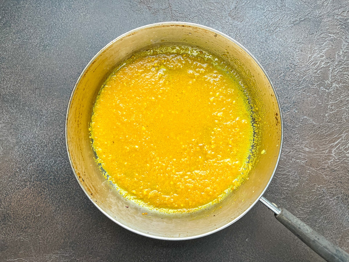 saffron turmeric mixture heated in saucepan.