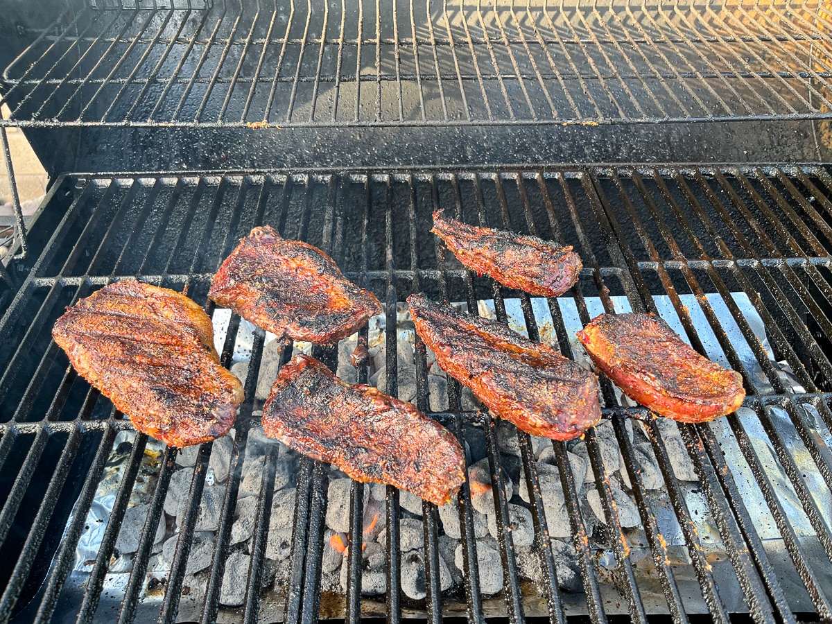 steaks on grill that was flipped over halfway through cooking process.