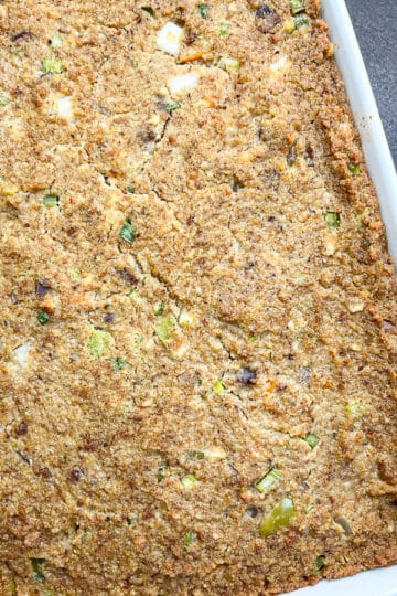 Overhead shot of Jiffy cornbread dressing in a white casserole dish.