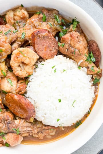 Close-up shot of Cajun Chicken Stew in a white bowl.