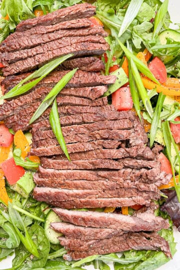 Overhead shot of salad on a white serving platter.