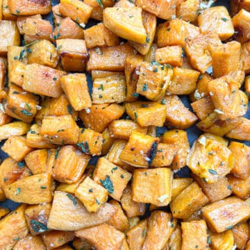 Close-up of savory roasted sweet potato cubes with caramelization.