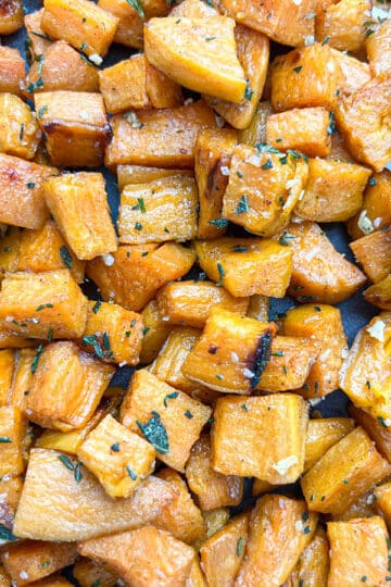 Close-up of savory roasted sweet potato cubes with caramelization.